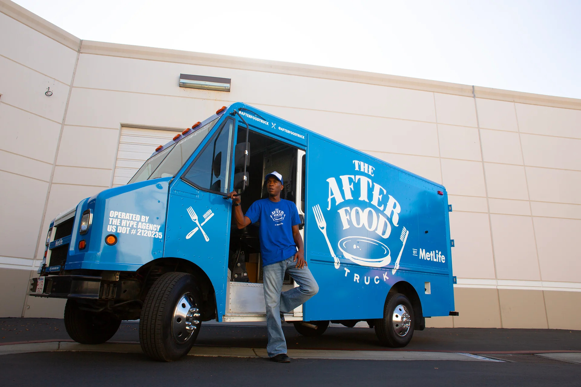 The After Food truck parked outside an office park, operator in the doorway