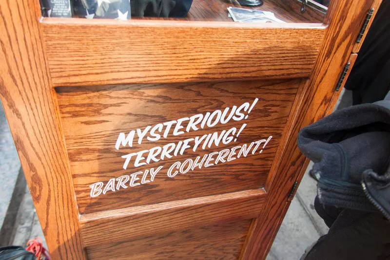 The cabinet’s painted side lettering: Mysterious! Terrifying! Barely coherent!